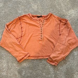a basic long sleeve shirt, in good condition, and lightly worn.